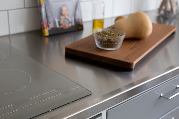 The grey cook top blends in well with the stainless steel, and it adds something to the kitchen.